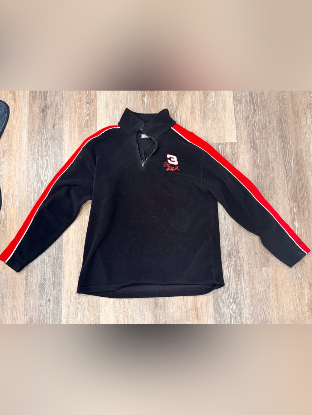 Dale Earnhardt Sr. (#3).Style: Vintage 1990s NASCAR quarter-zip fleece pullover.